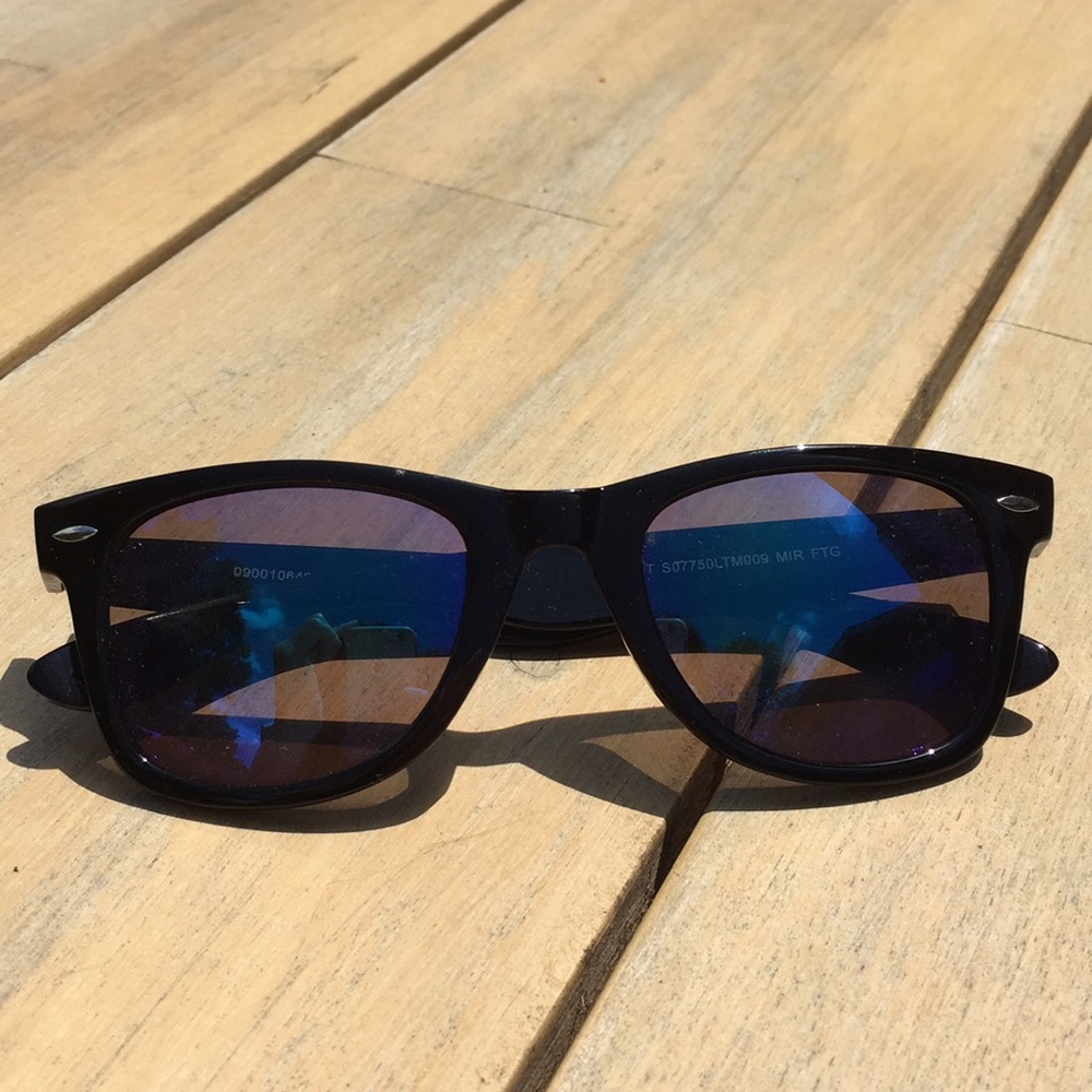 Black sunglasses with a blue reflective lens.